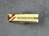 Kolkcjonerska przypinka w kształcie logo Wieidemann