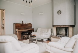 Meble skórzane Kler - sofa, dwa fotele i podnóżek w kolorze kremowym