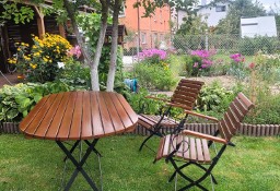 Drewniano-metalowy stół ogrodowy z zestawem sześciu krzeseł