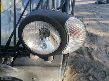 Lampa lewa przód Cat TH 414-1