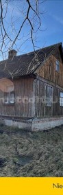 Siedlisko z drewnianym domem w gminie Chorzele.-4