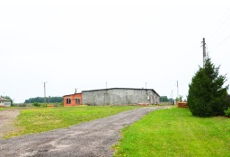 Nieruchomość z halą magazynową, budynkiem gospodarczym i budynkiem socjalnym.