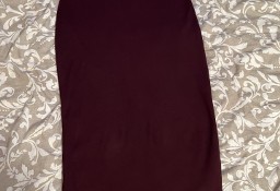 Long burgundy skirt.
