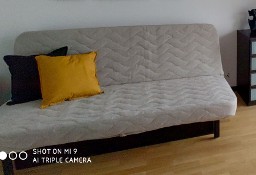 Sofa Nyhamn Ikea z pokryciem i pojemnikiem na pościel