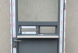 Drzwi aluminiowe z oknem przesuwnym w bok  - na wymiar